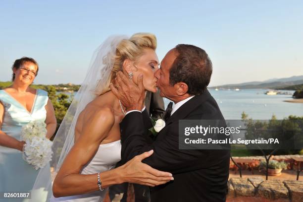 Singer Paul Anka and Anna Anka kiss during their wedding at Hotel Cala di Volpe on July 26, 2008 in Porto Cervo, Sardinia, Italy.