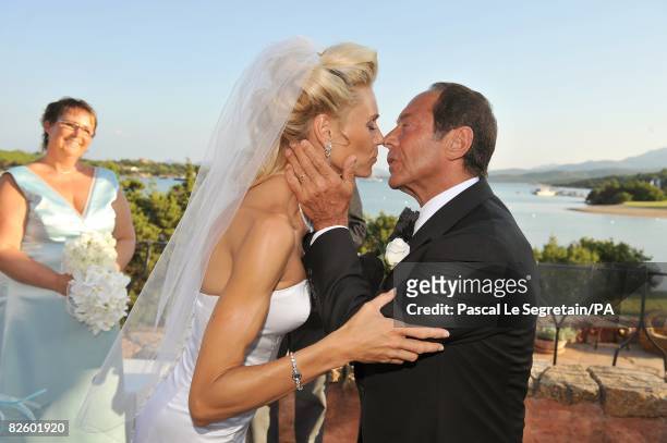Singer Paul Anka and Anna Anka kiss during their wedding at Hotel Cala di Volpe on July 26, 2008 in Porto Cervo, Sardinia, Italy.