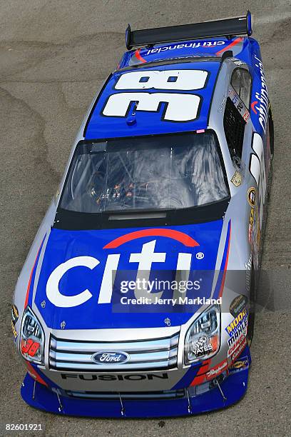 David Gilliland, driver of the CitiFinancial Ford, drives in the garage area during practice for the NASCAR Sprint Cup Series Pepsi 500 at Auto Club...