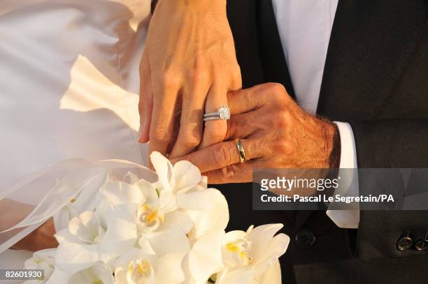 Singer Paul Anka and Anna Anka hold hands during their wedding at Hotel Cala di Volpe on July 26, 2008 in Porto Cervo, Sardinia, Italy.