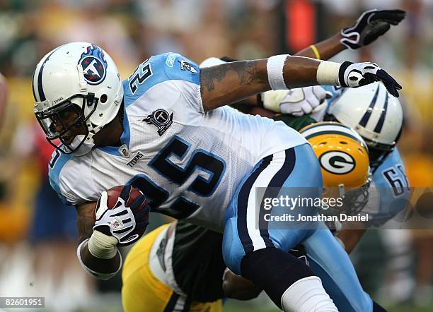 LenDale White of the Tenessee Titans runs for yardage against the Green Bay Packers on August 28, 2008 at Lambeau Field in Green Bay, Wisconsin.The...