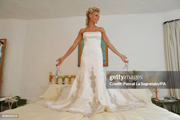 Anna Anka poses in her wedding dress before her wedding with Paul Anka celebrated in front of the yacht M.Y Siran docked at Cala di Volpe Bay on July...