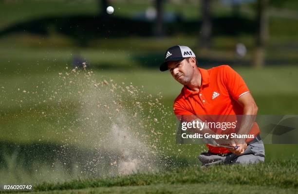 Sergio Garcia plays a shot out of a bunker on the fifth hole during the first round of the World Golf Championships - Bridgestone Invitational at...