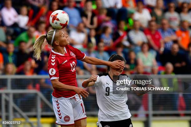 Denmark's forward Stine Larsen jumps for the ball next to Austria's forward Sarah Zadrazil during the UEFA Womens Euro 2017 football tournament...