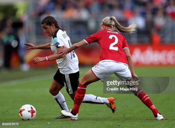 Laura Feiersinger of Austria avoids the challenge of Line Roddik of Denmark during the UEFA Women's Euro 2017 Semi Final match between Denmark and...