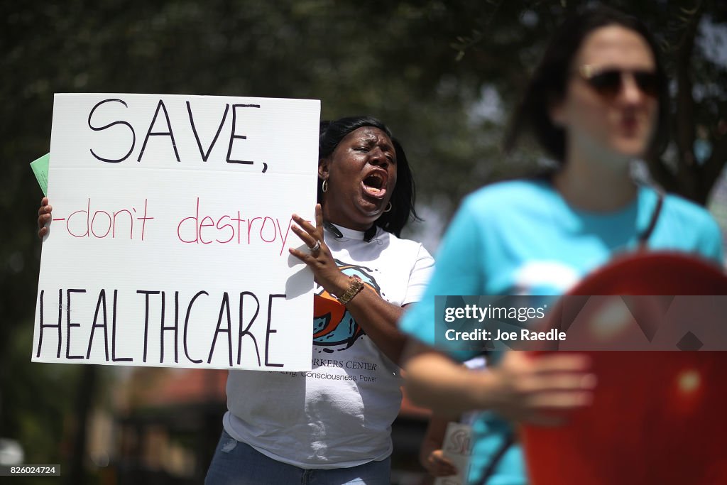 Activists Protest Healthcare Vote Of GOP Rep. Carlos Curbelo In Miami
