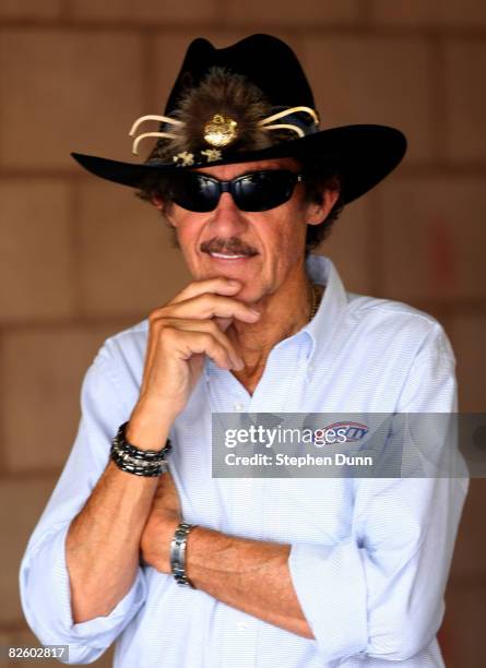 Richard Petty, past NASCAR champion and team owner of Petty Enterprises, stands in the garage during practice for the NASCAR Sprint Cup Series Pepsi...