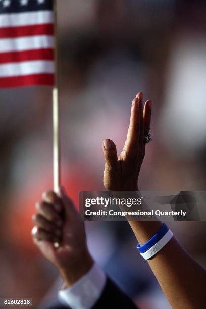 Admirers show support as Barack Obama addresses the more than 70,000 people that gathered to hear him accept the Democratic Party nomination on...