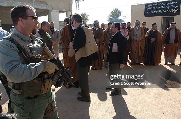 Jan. 25-- American Blackwater security guards protect American diplomats as they meet with Iraqi Shiites of the large Bani Hassan tribe and its new...