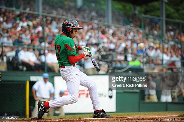 Emmanuel Rodriguez of the Matamoros Little League team hits during the World Series Championship game against the Waipio Little League team at Lamade...