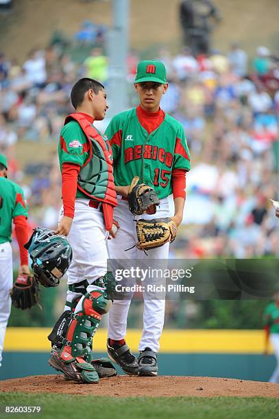 Sergio Rodriguez of the Matamoros Little League team talks with teammate Fernando Villegas during the World Series Championship game against the...