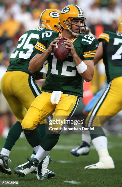 Aaron Rodgers of the Green Bay Packers drops back to pass on his only play of the game, a touchdown pass to Greg Jennings, in the 1st quarter against...