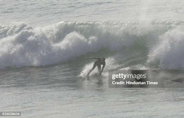 Sea Surfer Surfing on the waves of Indian ocean on the north beach of Durban on Wednesday.Hundreds of Surfers enjoyed surfing today as city witnessed...