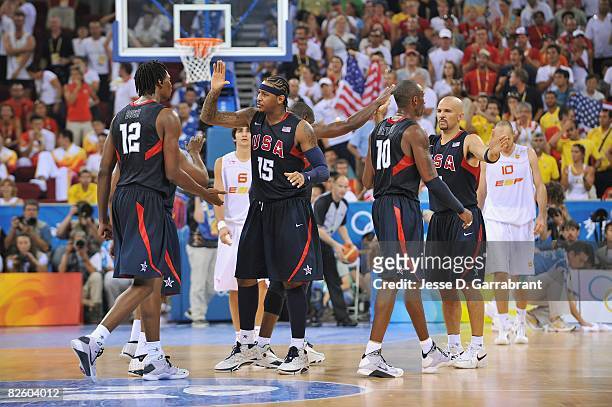 Chris Bosh, Carmelo Anthony, Dwyane Wade, Kobe Bryant, and Jason Kidd of the United States celebrate on the court during the gold medal game of the...
