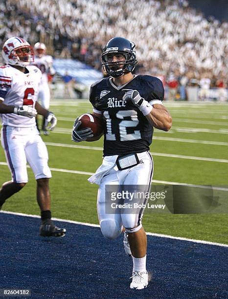 Tight end James Casey of the Rice University Owls scores on a seven yard pass in the first quarter at Rice Stadium August 29, 2008 in Houston, Texas.