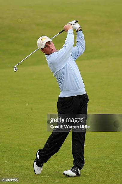 Jonathan Caldwell of Great Britain & Ireland plays his second shot into the third green during the foursomes matches of The St Andrews Trophy 2008...
