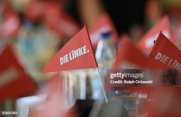 Flags of the far left-wing party Die Linke stand on tables during a party congress on August 30, 2008 in Lollar, Germany. Die Linke party of Hesse...