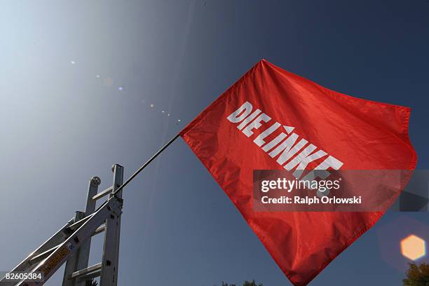 Flag of the far left-wing party Die Linke waves in the wind during a party congress on August 30, 2008 in Lollar, Germany. Die Linke party of Hesse...