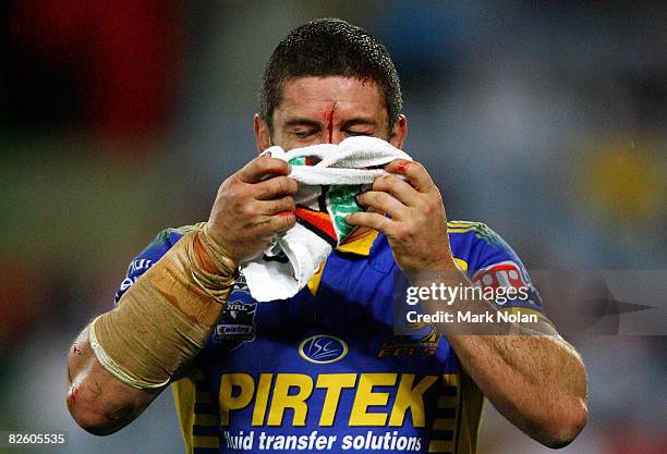 Nathan Cayless of the Eels leaves the field with a head injury after a clash with team mate Junior Paulo during the round 25 NRL match between the St...