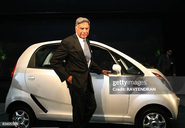 In this file photograph taken on January 10, 2008 chairman of India's giant Tata Group Ratan Tata poses in front of the Tata "Nano" car during the...