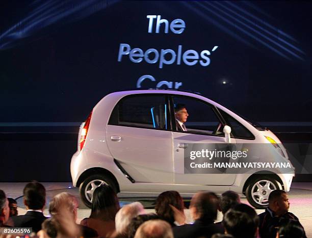 In this file photograph taken on January 10, 2008 chairman of the Tata Group, Ratan Tata drives the new Tata "Nano" car at its unveiling in New...