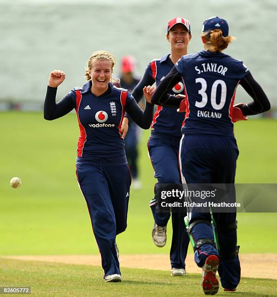 Holly Colvin of England celebrates taking the wicket of Indian captain Mithali Raj, caught by Sarah Taylor during the first Natwest Womens Series one...