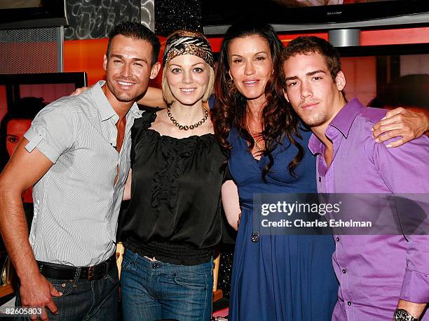 Host Janice Dickinson poses with models JP Calderon, Crystal Truehart and Nathan Fields after a model walk-off competition at the NBC Experience...