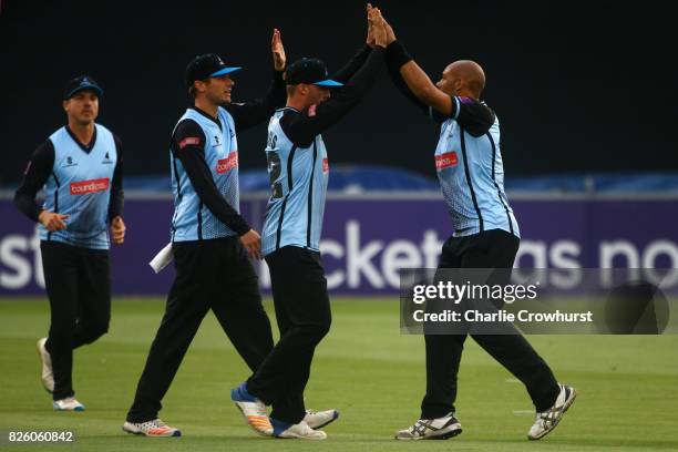 Tymal Mills of Sussex celebrates taking the wicket of Jason Roy of Surrey during the NatWest T20 Blast match between Sussex Sharks and Surrey at The...
