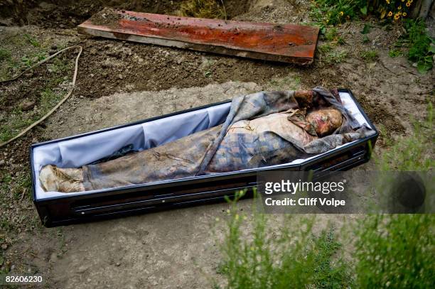 The corpse of 59 year old Aleko Bibilashvili lies in a coffin in his front yard on August 25, 2008 in Karaleti, Georgia. Bibilashvili was shot dead...