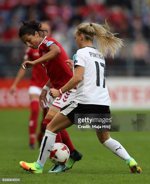 Nadia Nadim of Denmark holds off pressure from Sarah Puntigam of Austria during the UEFA Women's Euro 2017 Semi Final match between Denmark and...