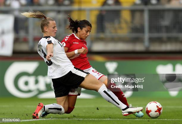 Nadia Nadim of Denmark shoots goalwards under pressure from Virginia Kirchberger of Austria during the UEFA Women's Euro 2017 Semi Final match...