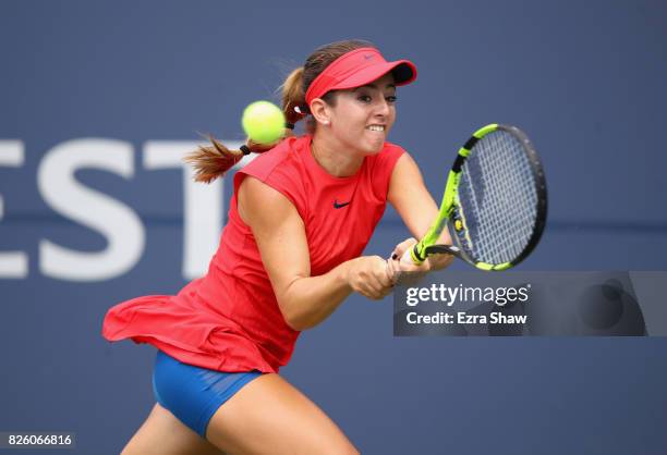Catherine Bellis of the United States returns a shot to Veronica Cepede Royg of Paraguay during Day 4 of the Bank of the West Classic at Stanford...