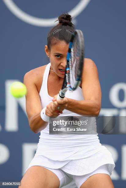 Veronica Cepede Royg of Paraguay returns a shot to Catherine Bellis of the United States during Day 4 of the Bank of the West Classic at Stanford...