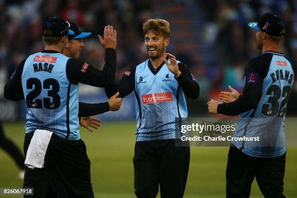 Will Beer of Sussex celebrates taking the wicket of Moises Henriques of Surrey during the NatWest T20 Blast match between Sussex Sharks and Surrey at...