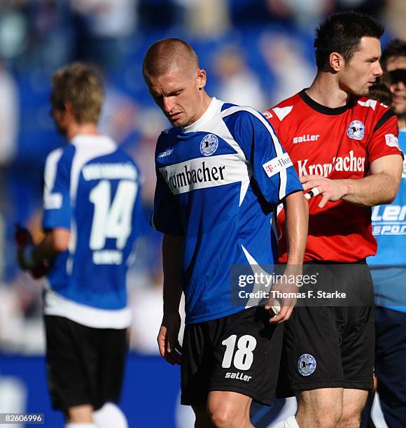 Jonas Kamper, Artur Wichniarek and Dennis Eilhoff of Bielefeld look dejected after during the Bundesliga match between Arminia Bielefeld and...