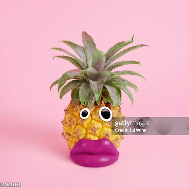 pineapple with face made of fake lips and googly eyes - googly eyes stock pictures, royalty-free photos & images