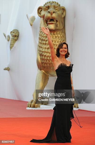 Italy's actress Monica Guerritore waves to photographers before the screaming of the movie "Un Giorno Perfetto" directed by Turkey's director Ferzan...