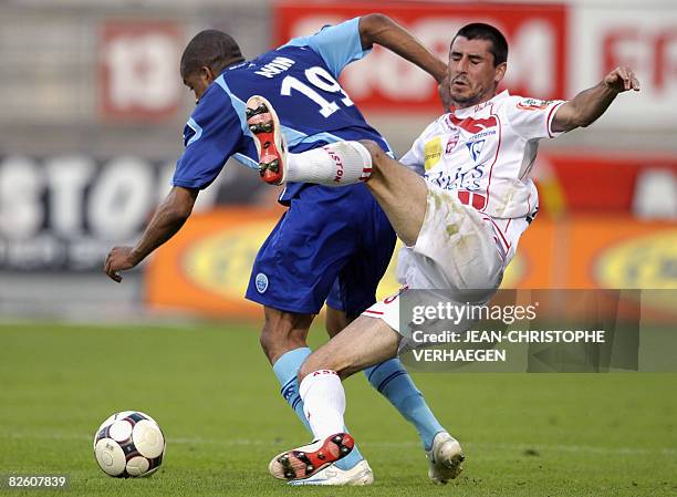 Nancy's midfielder Julien Feret fights for the ball with Le Havre's midfielder Kevin Anin during their French L1 football match at Marcel Picot...