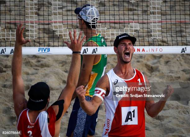 Martin Ermacora and Moritz Pristauz of Austria celebrate during the Men's Main draw elimination match between Austria and Brazil on August 03, 2017...