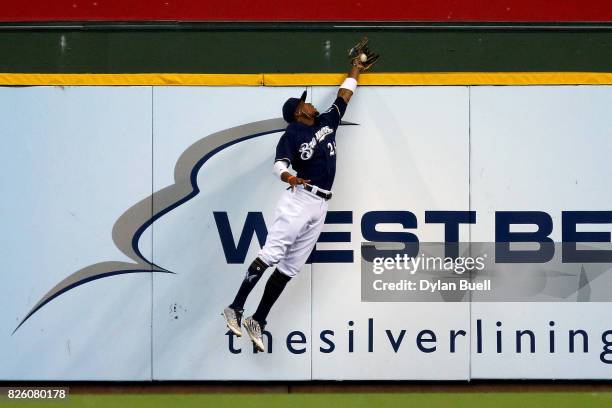 Keon Broxton of the Milwaukee Brewers leaps to catch a fly ball in the second inning against the St. Louis Cardinals at Miller Park on August 3, 2017...
