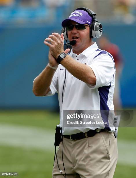 Head coach Skip Holtz of the East Carolina Pirates cheers on his team against the Virginia on August 30, 2008 at Bank of America Stadium in...