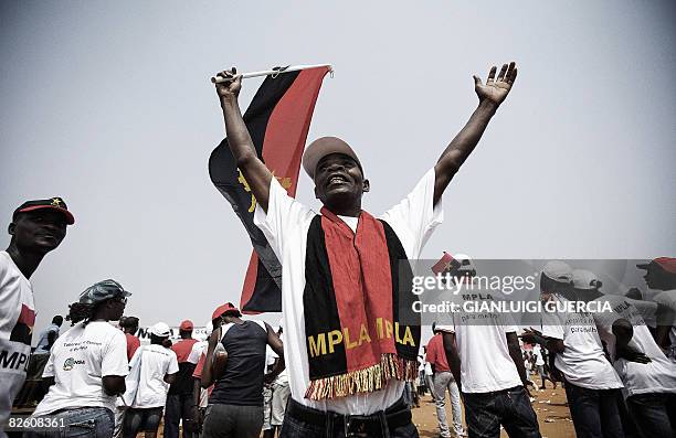 Angolan ruling party MPLA supporters cheer on August 30, 2008 at an electoral campaign rally in Benfica, on the outskirts of Luanda. The ruling...