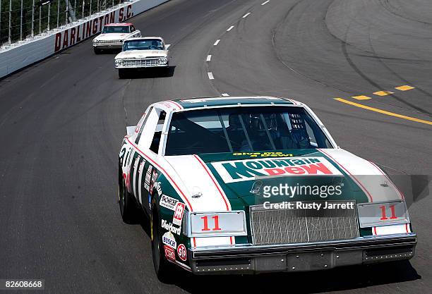 Darrell Waltrip, drives the famed Mountain Dew Chevrolet through turn three during the Darlington Vintage Racing Festival at Darlington Raceway on...