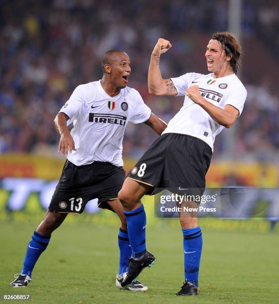 Zlatan Ibrahimovic celebrates with Douglas Maicon after scoring during the Serie A match between Sampdoria and Inter at the Stadio Marassi on August...