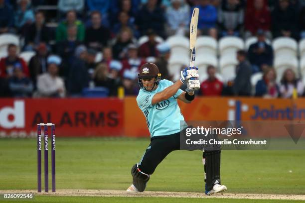 Tom Curran of Surrey hits out during the NatWest T20 Blast match between Sussex Sharks and Surrey at The 1st Central County Ground on August 3, 2017...