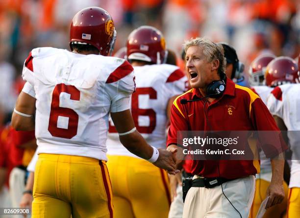 Head coach Pete Carroll congratulates uarterback Mark Sanchez of the Southern California Trojans after another touchdown in their 52-7 win over the...