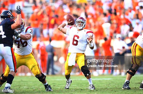 Quarterback Mark Sanchez of the University of Southern California Trojans passes against the University of Virginia Cavaliers on August 30, 2008 at...