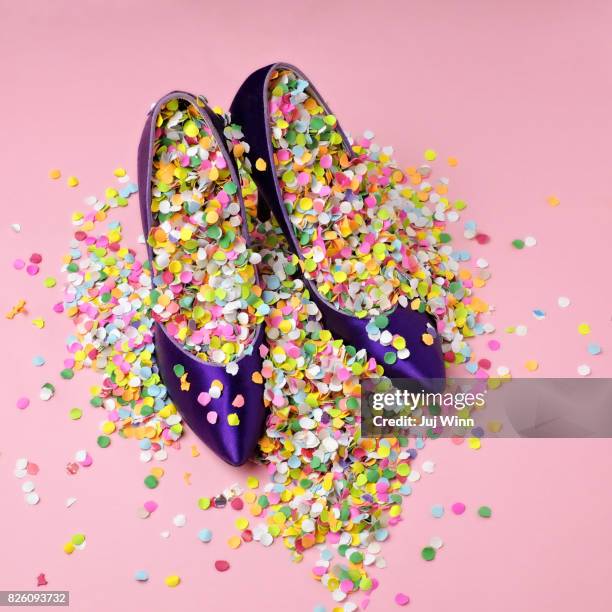 shoes filled with confetti - colorful shoes stock pictures, royalty-free photos & images