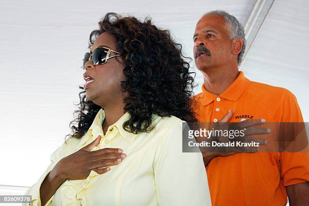 Oprah Winfrey and Stedman Graham recite the Pledge of Allegiance at the 20th Reunion Festival August 30 ,2008 in Whitesboro, New Jersey.