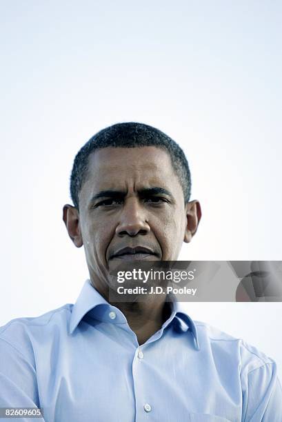 Democratic U.S. Presidential nominee Sen. Barack Obama listens as Democratic U.S. Vice-presidential nominee Sen. Joe Biden speaks as they campaign...